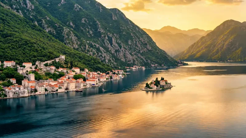 Bay of Kotor in Montenegro with medieval old town and mountains at golden hour
