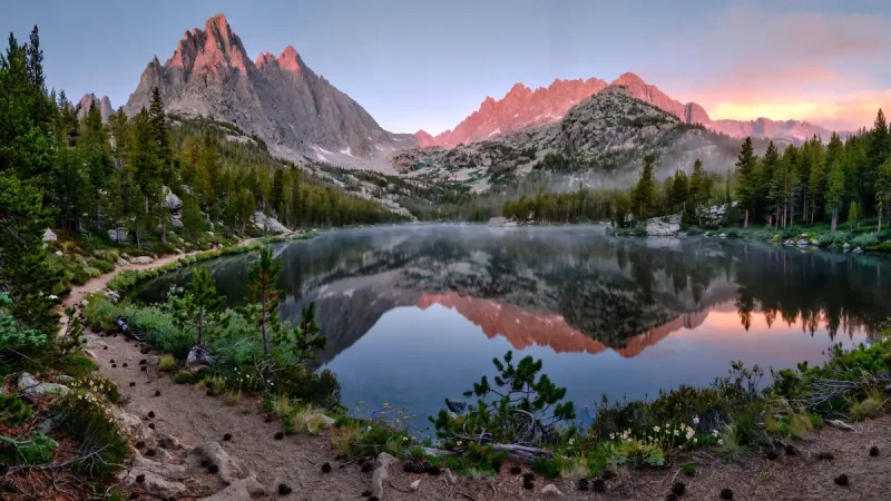 Sunrise over Dream Lake with granite peaks reflected in Rocky Mountain National Park, Colorado
