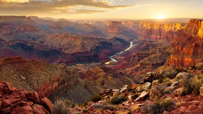 Layered red rock and golden light at the Grand Canyon, one of the most scenic places to visit in the US